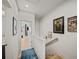 Upstairs hallway featuring art and decor, leading to other rooms in the home at 166 Color Cir, Atlanta, GA 30317