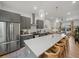 Open-concept kitchen with a large island, modern appliances, and seamless flow to the living area at 166 Color Cir, Atlanta, GA 30317