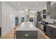 Stylish kitchen with a spacious island, stainless steel appliances, and backyard view at 166 Color Cir, Atlanta, GA 30317