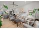 Spacious living room with comfortable seating, hardwood floors, and a ceiling fan at 166 Color Cir, Atlanta, GA 30317