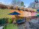 Private patio with outdoor seating, vibrant wall art, and stylish decor at 166 Color Cir, Atlanta, GA 30317