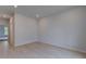 Modern bedroom featuring light hardwood floors and neutral gray wall paint at 177 Haverling Pass, Hampton, GA 30228