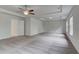 Large main bedroom showcasing carpet, tray ceiling, a ceiling fan, and lots of space at 177 Haverling Pass, Hampton, GA 30228