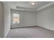 Comfortable bedroom with neutral walls, plush carpet, and natural light at 177 Haverling Pass, Hampton, GA 30228