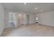 Versatile bonus room featuring hardwood floors, open space, and a convenient laundry closet at 177 Haverling Pass, Hampton, GA 30228