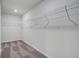 Spacious walk-in closet featuring ample storage with wire shelving and plush carpeting for organized living at 177 Haverling Pass, Hampton, GA 30228