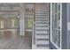 Elegant home entryway with a staircase and hardwood floors at 177 Haverling Pass, Hampton, GA 30228