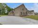 Spacious home showcasing a three-car garage and a wide driveway at 177 Haverling Pass, Hampton, GA 30228