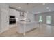 Modern kitchen features a large center island, stainless steel appliances, and ample cabinet space at 177 Haverling Pass, Hampton, GA 30228