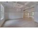 Bright and open living room with decorative trim and wood flooring at 177 Haverling Pass, Hampton, GA 30228