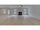 Spacious living room features a modern fireplace, hardwood floors, and lots of natural light at 177 Haverling Pass, Hampton, GA 30228