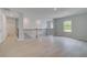 Spacious loft with neutral walls, hardwood floors, stylish railing, and abundant natural light at 177 Haverling Pass, Hampton, GA 30228