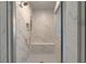 Bright tiled shower stall with rainfall showerhead and built in bench at 177 Haverling Pass, Hampton, GA 30228