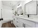 Bright bathroom features double sinks, modern fixtures, and a shower-tub combo at 185 Willow Stream Ct, Roswell, GA 30076