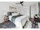 A modern bedroom with a ceiling fan, stylish decor, and closet at 185 Willow Stream Ct, Roswell, GA 30076