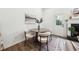 The dining area showcases a round table, modern chairs, and natural light coming in from the back door at 185 Willow Stream Ct, Roswell, GA 30076