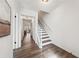 Bright entryway featuring hardwood floors and a staircase with white railings at 185 Willow Stream Ct, Roswell, GA 30076