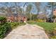 Two-story brick home with a spacious backyard and driveway at 185 Willow Stream Ct, Roswell, GA 30076