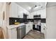 Modern kitchen features quartz countertops, stainless steel appliances, white cabinetry, and a stylish backsplash at 185 Willow Stream Ct, Roswell, GA 30076
