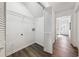 Laundry area with a vaulted ceiling, wire rack shelving and a folding door at 185 Willow Stream Ct, Roswell, GA 30076