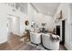 Bright living room boasts a fireplace, vaulted ceilings, and an open floor plan to the kitchen and dining area at 185 Willow Stream Ct, Roswell, GA 30076