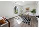 Bright home office with stylish decor, hardwood floors, and a large window at 185 Willow Stream Ct, Roswell, GA 30076