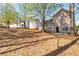 A view of the backyard showcasing the house exterior and yard at 4183 Ward Lake Trl, Ellenwood, GA 30294