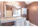 Bathroom featuring a vanity, mirror, toilet, and shower with bathtub at 4183 Ward Lake Trl, Ellenwood, GA 30294
