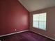 Cozy bedroom featuring a window for natural light and plush carpeting for added comfort at 4183 Ward Lake Trl, Ellenwood, GA 30294