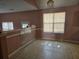 Bright dining area featuring large windows, tile flooring, and ample space at 4183 Ward Lake Trl, Ellenwood, GA 30294