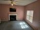 Inviting living room with a fireplace, ceiling fan, and ample sunlight at 4183 Ward Lake Trl, Ellenwood, GA 30294