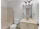 Bathroom features a bathtub, toilet, vanity, and mirror with ample lighting at 2859 Royal Blf, Decatur, GA 30030