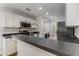 Bright kitchen featuring stainless appliances, white cabinets, and dark countertop with bar seating at 2859 Royal Blf, Decatur, GA 30030