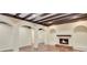 Basement with wooden beams, fireplace and arched doorways at 3196 Andrews Nw Ct, Atlanta, GA 30305