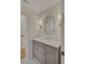 Bathroom featuring a gray vanity with a white countertop and decorative mirror at 3196 Andrews Nw Ct, Atlanta, GA 30305