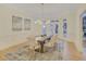 Formal dining room with wainscoting, decorative chandelier, and a neutral rug and paint palette at 3196 Andrews Nw Ct, Atlanta, GA 30305