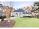 Elegant two-story home boasting a manicured lawn, circular driveway, and timeless architectural details at 3196 Andrews Nw Ct, Atlanta, GA 30305