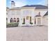 Elegant white home featuring arched windows, shutters, and manicured landscaping at 3196 Andrews Nw Ct, Atlanta, GA 30305