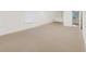 Empty room featuring neutral carpet and a set of built-in shelves at 3196 Andrews Nw Ct, Atlanta, GA 30305