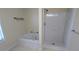 Corner soaking tub adjacent to separate shower at 5928 Springfair Run, Lithonia, GA 30038