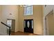 Spacious two-story foyer with hardwood floors and decorative front door window at 5928 Springfair Run, Lithonia, GA 30038