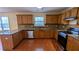 Well-lit kitchen with granite counters, tile backsplash, stainless appliances, and ample wood cabinetry at 5928 Springfair Run, Lithonia, GA 30038