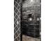 Luxurious shower featuring gray marble and patterned tile at 1131 Lupo Loop, Chattahoochee Hills, GA 30268