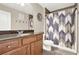 Bathroom featuring a vanity with a granite countertop and a shower with a decorative curtain at 117 Cottage Nw Walk, Cartersville, GA 30121