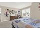 Bedroom featuring a large window, neutral walls, and decor featuring sports and cartoon themes at 117 Cottage Nw Walk, Cartersville, GA 30121