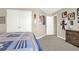 Bedroom boasting a spacious closet, neutral walls, and decorative posters at 117 Cottage Nw Walk, Cartersville, GA 30121