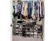 A well-organized closet featuring clothing racks and several shelves containing shoes and accessories at 117 Cottage Nw Walk, Cartersville, GA 30121