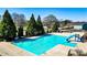 An aerial view of the large community pool surrounded by mature trees and amenities at 117 Cottage Nw Walk, Cartersville, GA 30121