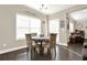Charming breakfast nook with bright natural light, table set for four, and hardwood floors at 117 Cottage Nw Walk, Cartersville, GA 30121