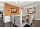 This dining area features a wooden table with bench seating and an orange accent wall at 117 Cottage Nw Walk, Cartersville, GA 30121